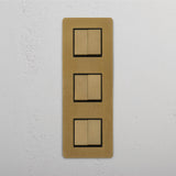 Vertikaler Wippschalter mit sechs Positionen – Antikes Messing + Schwarz – auf weißem Hintergrund